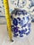 Experience the elegance of traditional Chinese artistry with this hand-painted Chinoiserie vase. The classic blue and...