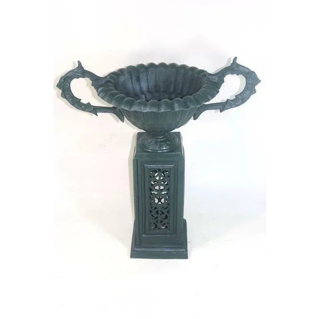Elegant American Victorian Floor Model urn planter fabricated of cast metal. Attributed to J.W. Fiske and Company, the...