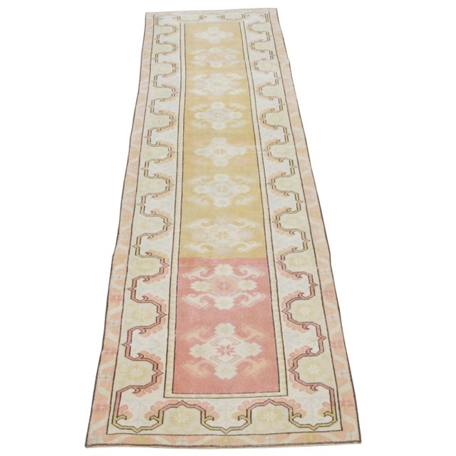 Vintage Turkish Anatolian hand knotted runner rug with natural colors, contemporary style and soft texture.