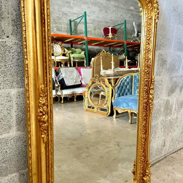 This French style gold floral floor mirror is a luxurious statement piece that combines exquisite craftsmanship with...