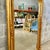 This French style gold floral floor mirror is a luxurious statement piece that combines exquisite craftsmanship with...