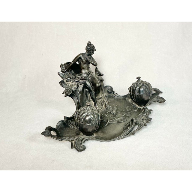 19th Century Art Nouveau cast Pewter inkwell with double ink holders. Features naked woman, dragonfly, butterfly and...
