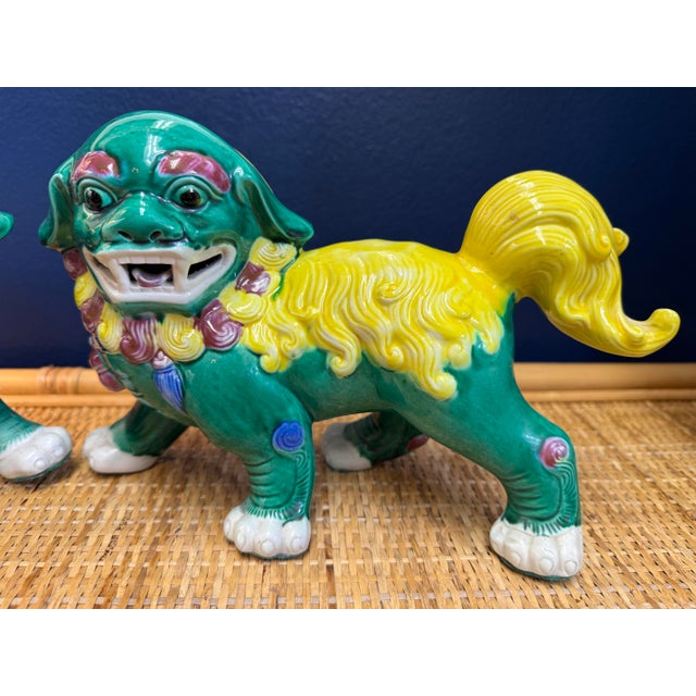 These playful foo dogs will certainly add color and charm to your home. They are so bright and cheerful! Predominately...