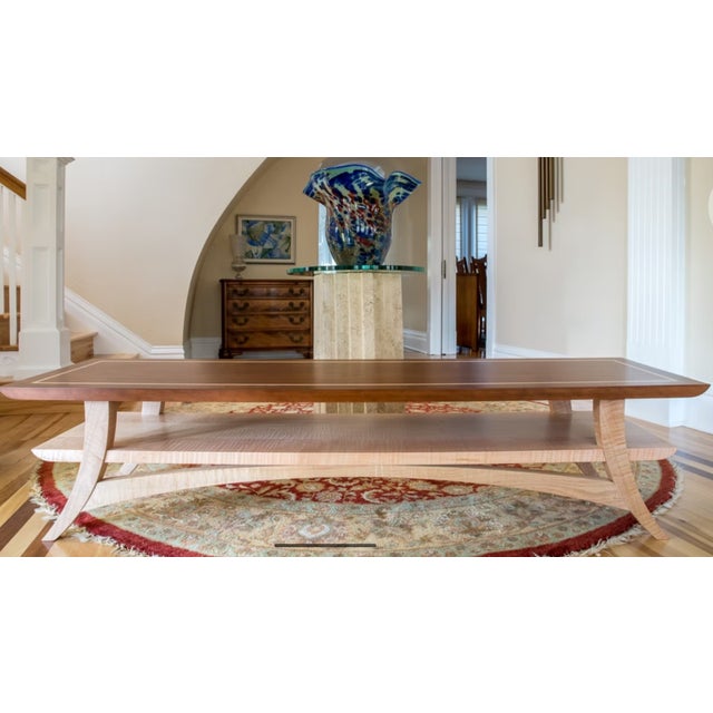 This gorgeous piece features stunning arches, mortise and tenon joinery and a stylish maple inlay.