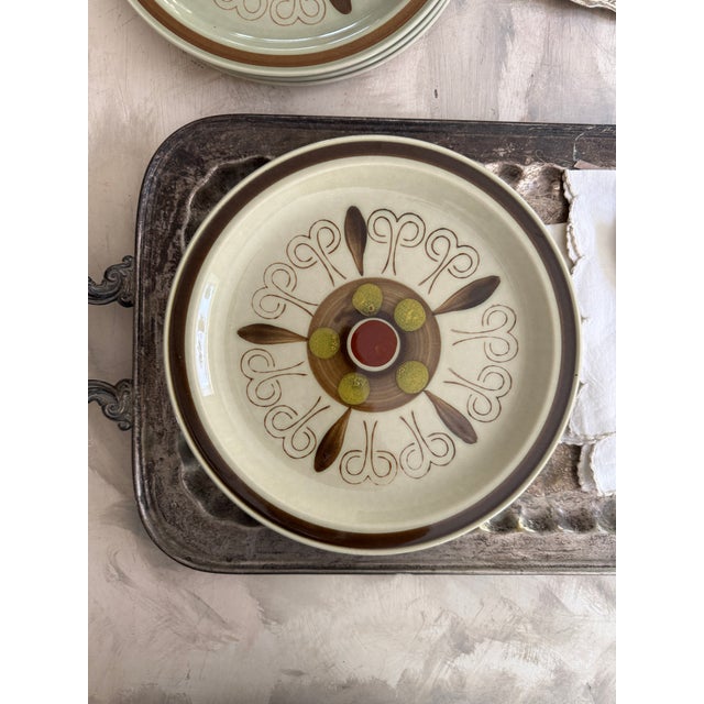 A striking set of eight Shino Stone “Marguerita” dinner plates, made in Japan and measuring 10.25 inches in diameter. This...