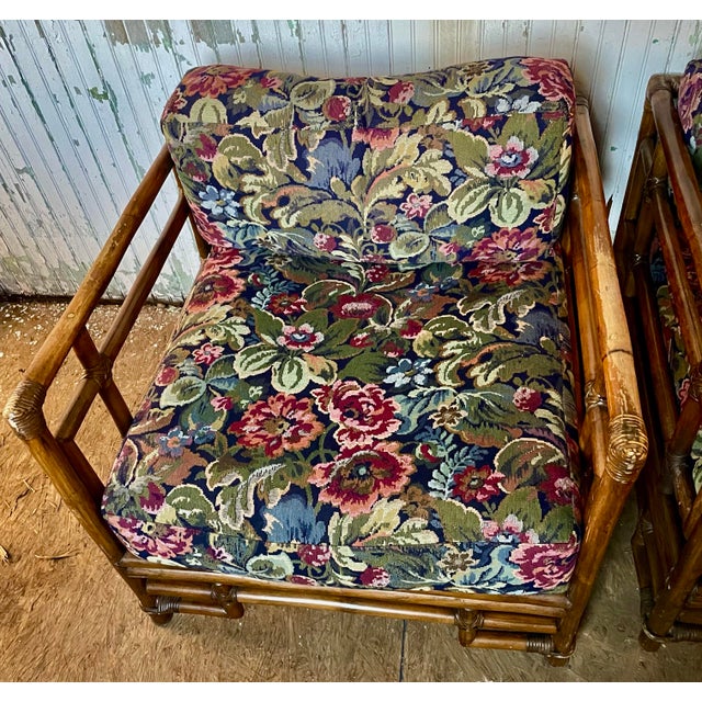 This is a fantastic pair of Ficks Reed bamboo/rattan arm chairs with an Asian inspired style and floral upholstery. They...