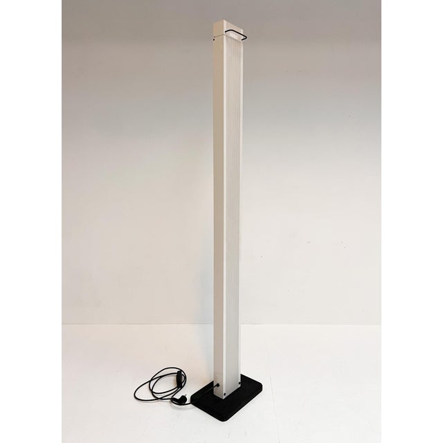 Architectural Zagar floor lamp by Sergio Carpani for Stilnovo from the 1980s. The 183 cm tall lamp is made of lacquered...
