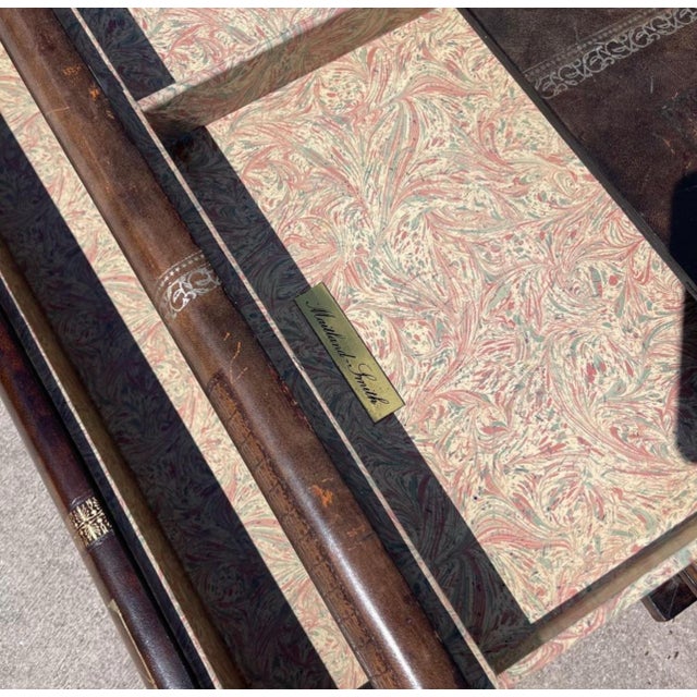 Fabulous Maitland-Smith tooled leather coffee table in the form of stacked books.