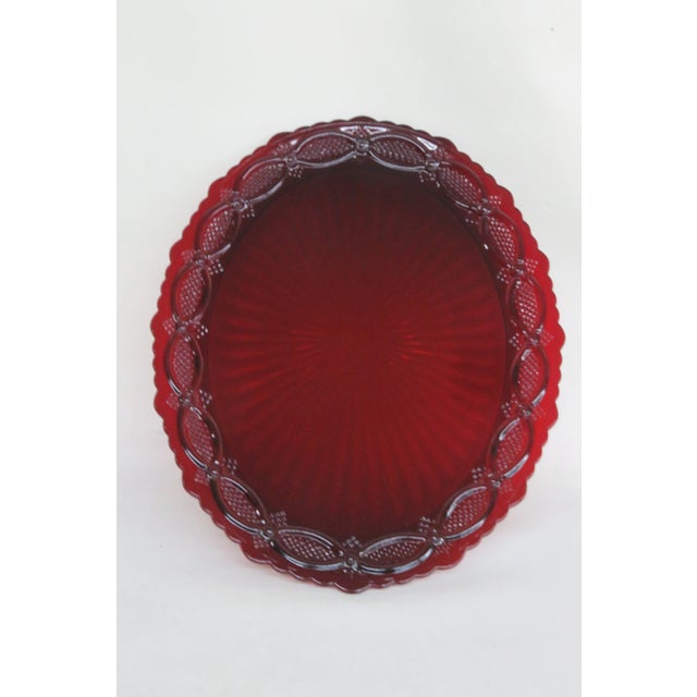 This stunning Serving Plate is made of glass. This Plate is stamped on the bottom as being made by Avon, it is the Cape...