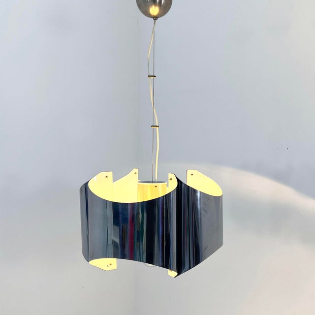 Folded Chromed Chandelier, 1970s, in Good conditions. Designed 1970 to 1979 Up to 250V (Europe/UK Standard).The wiring of...