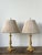 This masterfully crafted pair of Empire-style candlestick lamps exudes neoclassical grandeur, featuring substantial gilt...