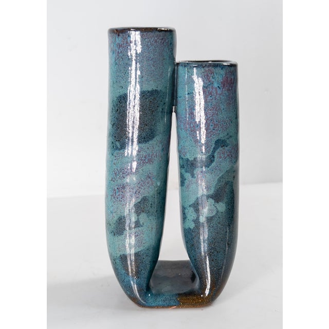 We are selling this pretty turquoise and teal glazed double mouthed vas.e This Mid-Century art pottery vase has nice...