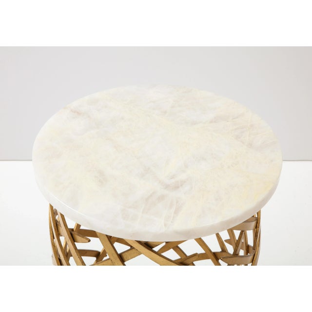 Wonderful 1970's Brutalist Metal side tables in a gilt finish. The tables have New polished Crystalline Quartz tops which...