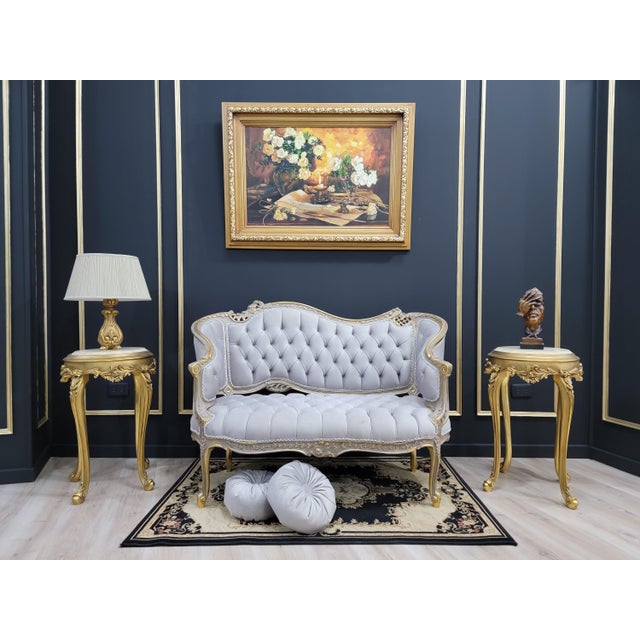 The finesse of wood work combines with the fabulousness of antique style on this banquette sofa. The look is pure...