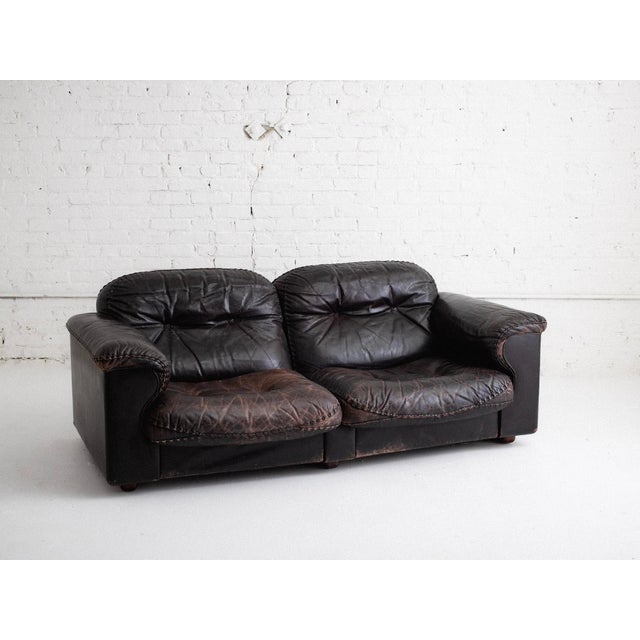 Mid-century two-seater "DS101" leather sofa by De Sede. Original espresso leather upholstery with signature braided...