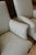 Sophisticated pair of French lounge chairs circa 1930. Stylish with high backs, rolled arms and turned legs finished with...