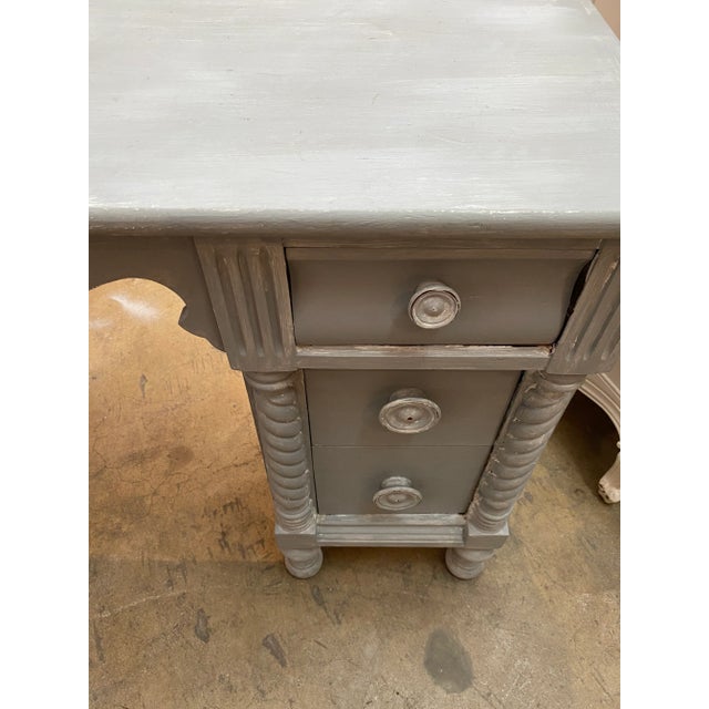 Exquisite antique English style desk or vanity table , chalky light gray patina finish. Opening for the chair is 18” wide.