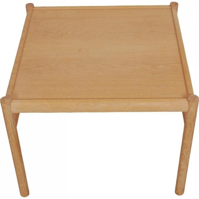 Coffee table designed by Ole Wanscher from 2018 and manufactured by Carl Hansen & Søn. The table is made of soap-treated...