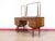 A stunning vanity made by British furniture maker Butilux, this Mid Century Modern Vintage Teak Vanity Desk embodies...