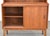 A mid century modern teak secretary desk with a pull out writing surface and upper bookshelf. Made in Denmark. Circa...