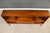 A mid century modern walnut bookcase with l shelves sitting on an iron base made by Stanley Furniture. Can he make...
