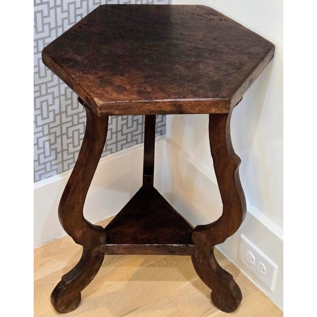 This antique Spanish Provincial hexagonal drink table brings Gothic Revival character and warm, timeworn patina to any...