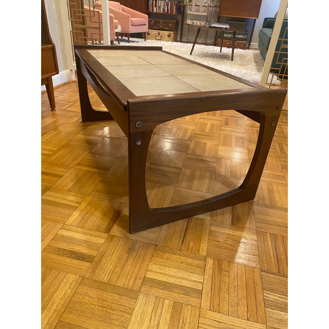 This beautiful MCM G-Plan coffee table with its sturdy but sleek (teak or walnut) base is sure to complement any 1960s...