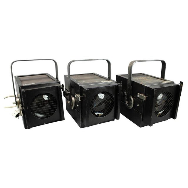 This impressive set of three matching theatrical spotlights was manufactured in 1990 by Divadelni Technika Praha, a Czech...