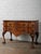 A finely crafted early 20th-century English Chippendale-style lowboy or small sideboard, constructed in burl walnut and...