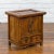A Chinese antique elm wood bedside cabinet from the early 20th century, with double doors, two drawers, iron hardware and...
