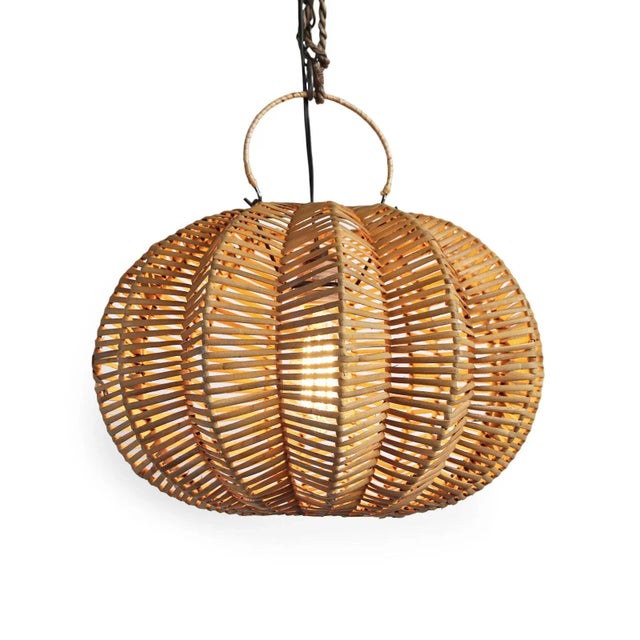 Handmade split stain rattan pumpkin lantern. Overall measurements are 16" x 16" x 12" with 3" top ring. Each lantern may...