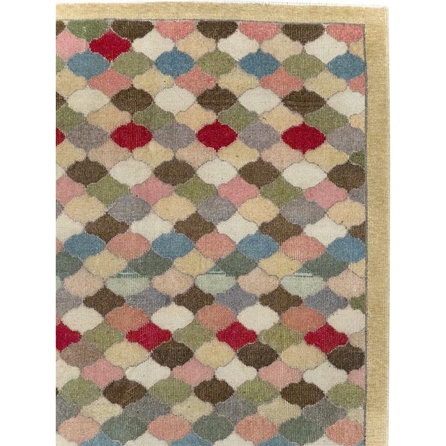 This mid-20th-century Turkish Anatolian wide gallery runner presents an allover pattern of small interlocking lozenges...