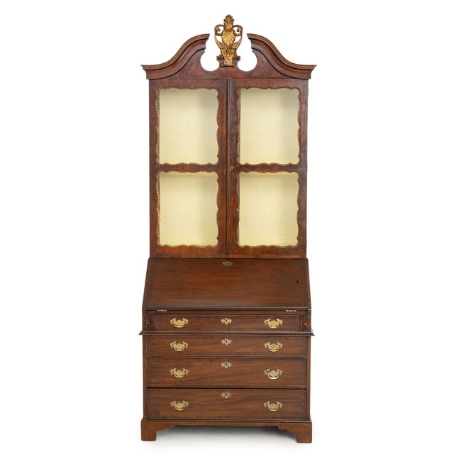 George II Style Parcel Gilt Walnut Bureau Bookcase, 19th century or earlier, the glass paneled doors with carved giltwood...