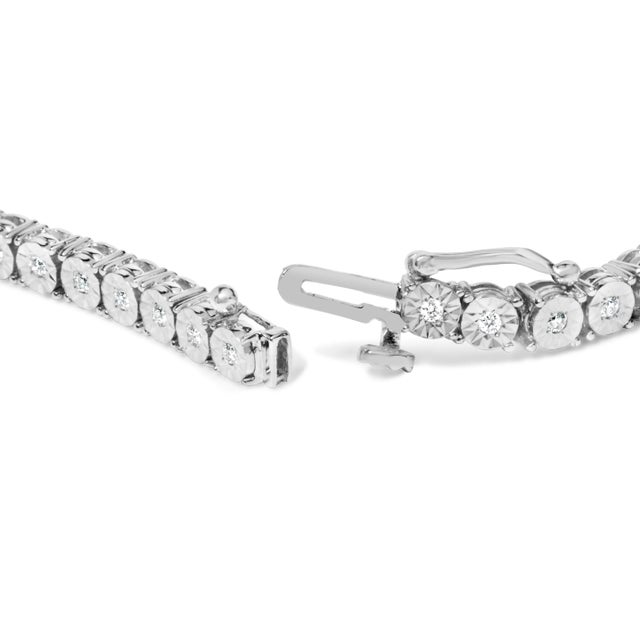 Beautiful and elegant, this silver tennis bracelet has a timeless design that will never go out of style. With a total...
