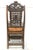 This product is a pair of antique heavily hand carved wooden armchairs from the late 19th century. They are intricately...