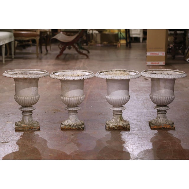 This elegant set of four 19th-century Medici vases were crafted in France circa 1860 and reflect the timeless grandeur of...