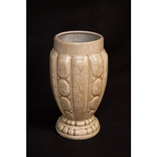This stoneware vase was produced by the Mougin workshop in Nancy in the 1920s, at a time when Joseph Mougin—winner of the...