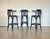 Three 1960s bar stools, dark blue lacquered wood