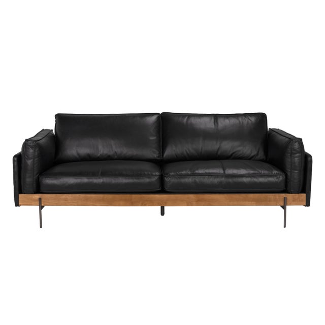 Bold, streamlined, and built to last, this Onyx Black Leather Sofa brings together rich materials and refined design....