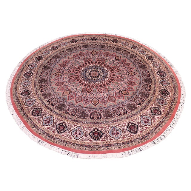 This hand‑knotted Pak Persian round rug showcases the finest expression of traditional Persian artistry. Each piece is...