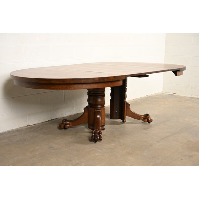 R. J. Horner Style Antique Victorian Carved Oak Split Pedestal Extension Dining Table With Lion Paw Feet | Newly Refinished For Sale - Image 10 of 14
