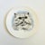 A circular vintage ceramic plate with the design of a cat. Made by Poole, England and marked on the back. Measures 6"Dia x...