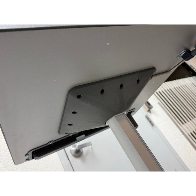 Design Plus Gallery presents a Mobile Adjustable Desk from Ergotron. This adjustable desk has a maple top with a...