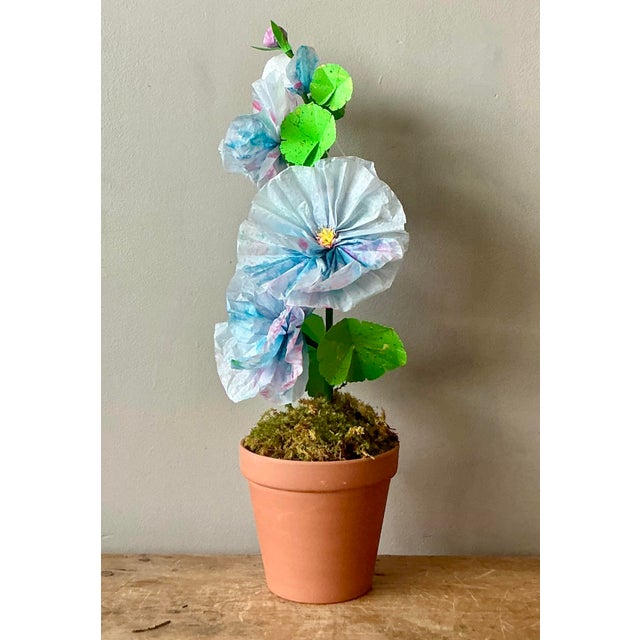 Contemporary hand-rolled paper flowers are a modern, artistic take on traditional floral arrangements. These flowers are...