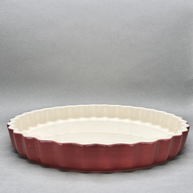 • Emile Henry round fluted tart pan with scalloped edges. • Made in France; vintage French kitchenware. • Burgundy red...