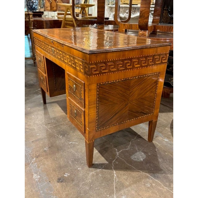 The 19th Century Italian Desk with Greek Key Inlay is a stunning piece of furniture that exudes elegance and...