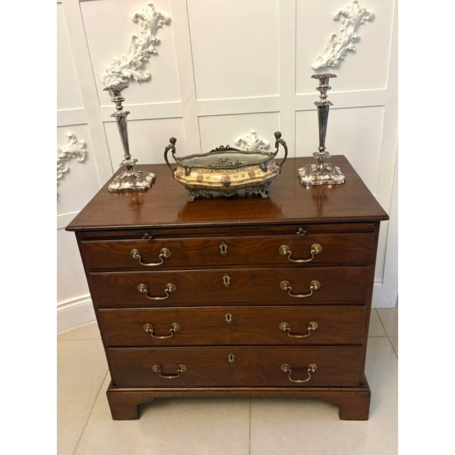 A fine George III mahogany chest of drawers of pleasing proportions showcasing the understated elegance and quality...