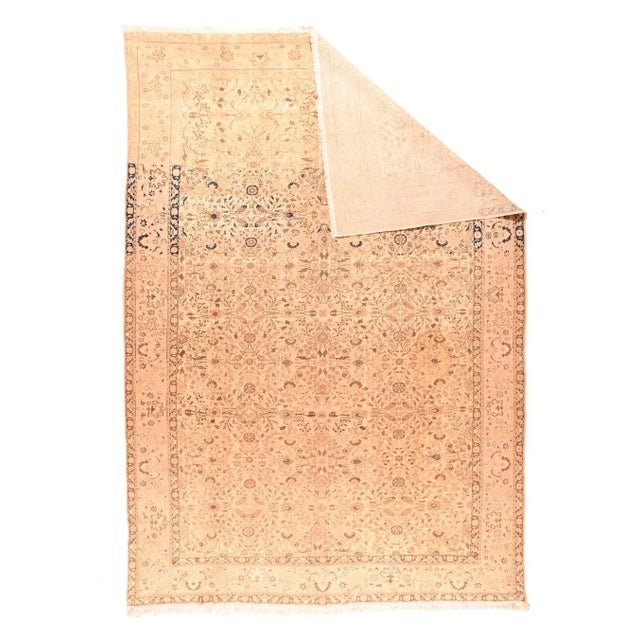 Strongly panel-abrashed at one end, the straw-sand field show sprays, stems and rosettes in an allover manner. Abrash...