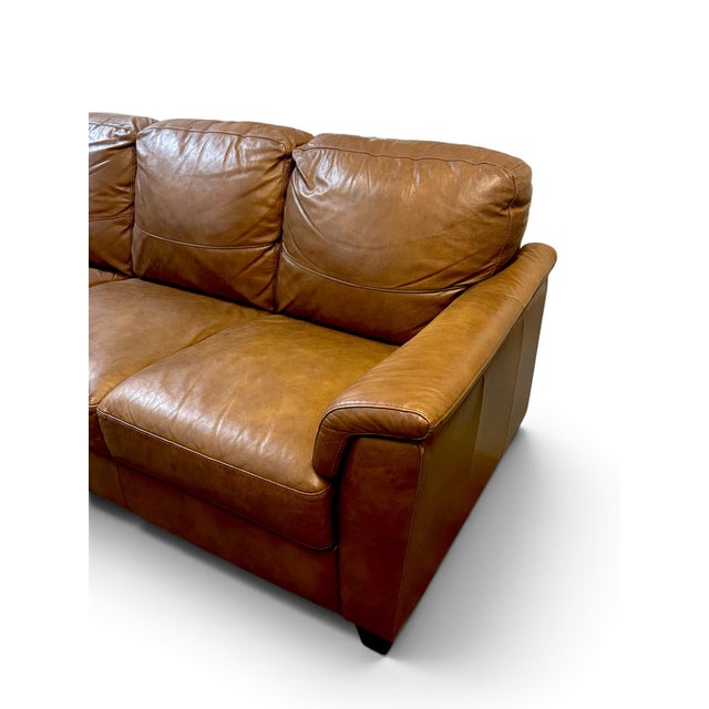 Leather sofa by Digiò. Made in Italy. Cushions are all attached. Super comfortable- very minimal wear to leather.