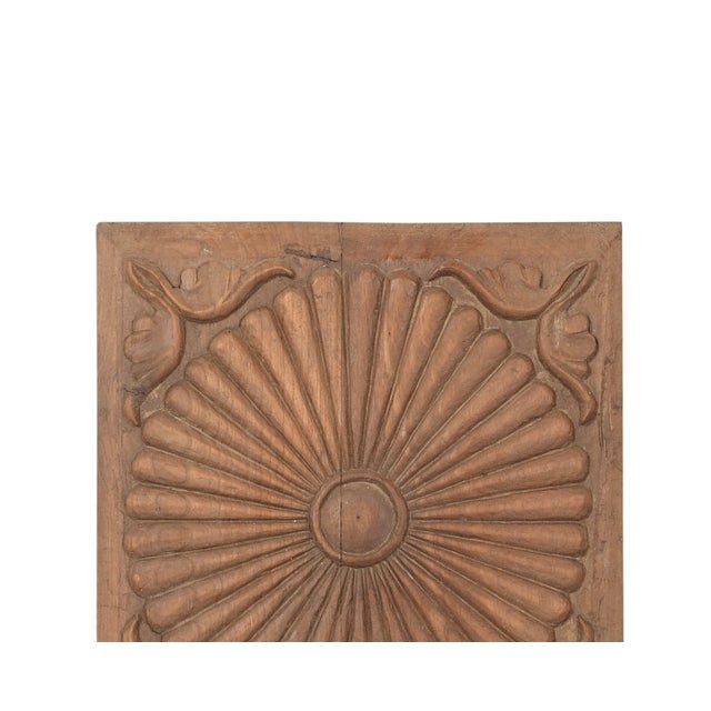 This Antique Indian Carved Teakwood Sunburst Panel is hand-carved from solid teakwood with remarkable precision and...